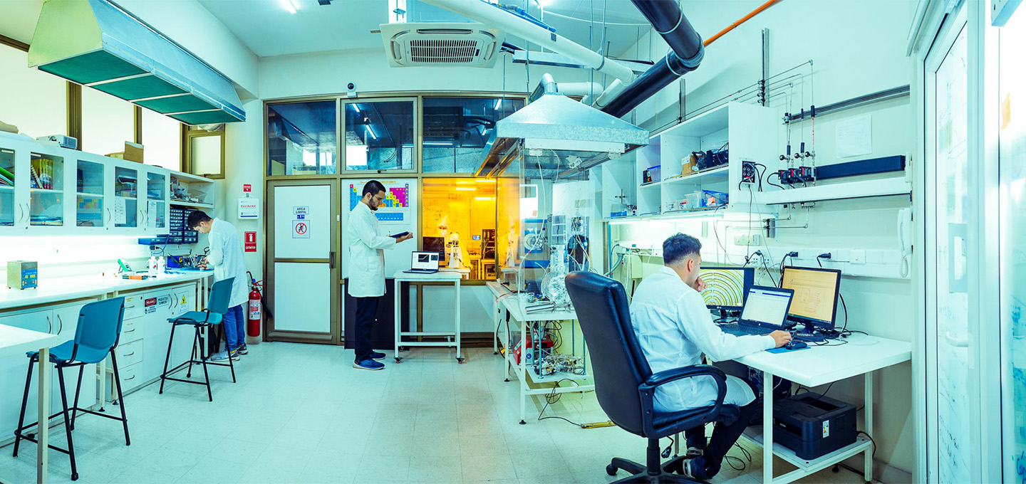High-tech laboratory equipment with researchers conducting experiments.